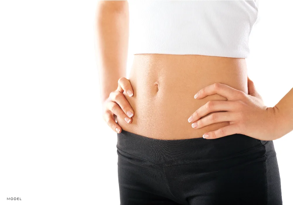 Woman's Flat Tummy with Hands on Waist